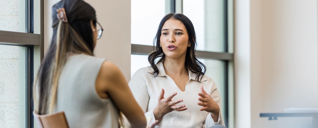two female colleagues talking